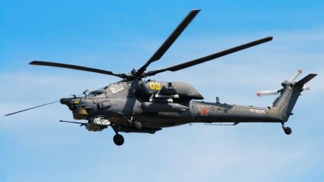 Military Helicopter in Action Against Clear Blue Sky wallpaper