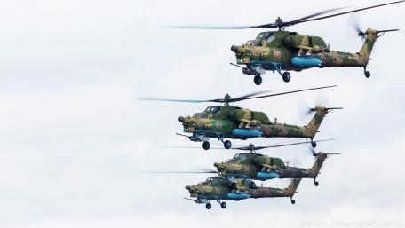 Powerful Military Helicopters in Formation Flight wallpaper