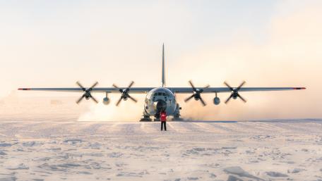 Majestic Aircraft in Icy Landscape wallpaper
