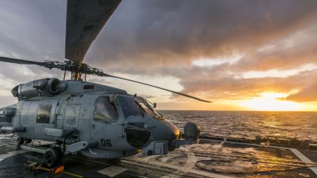 Helicopter at Sunrise Over Ocean wallpaper