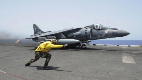 Military Aircraft in Action on Aircraft Carrier Deck wallpaper