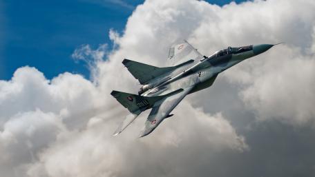 Soaring Through the Clouds with Power and Precision wallpaper