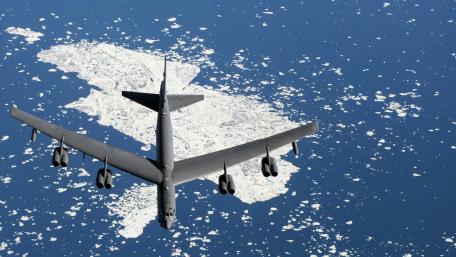 Military Aircraft Over Icebound Landscape Wallpaper wallpaper