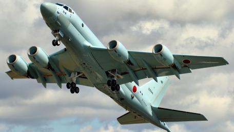Sleek Surveillance Aircraft in Action wallpaper
