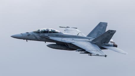 Fighter Jet in Action Dramatic Sky Displaying Military Power wallpaper