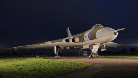 Vintage Military Bomber Under Night Sky wallpaper