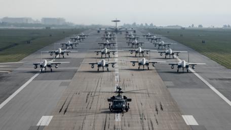 Military Aircraft in Precision Formation on Runway wallpaper