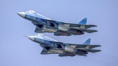 Dynamic Duo of Fighter Jets in Action wallpaper