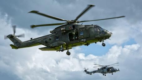 Helicopters in Action Above the Clouds wallpaper
