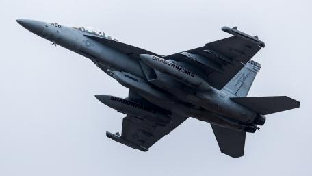 Fighter Jet in Action High Above the Clouds wallpaper