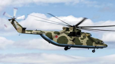 Military Helicopter in Action Above the Clouds wallpaper