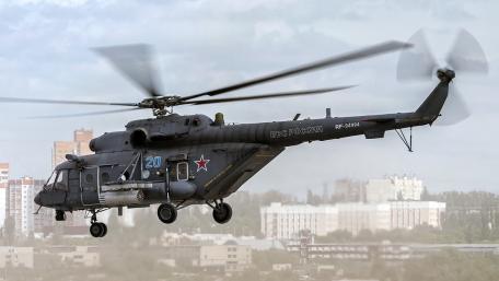 Military Helicopter in Action Displaying Air Power and Precision wallpaper