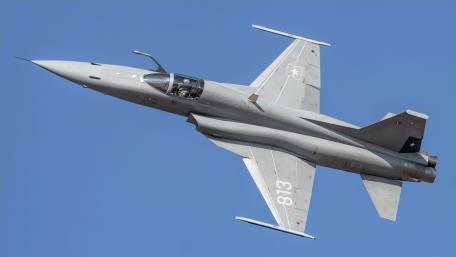 Sleek Fighter Jet in Action Above the Clouds wallpaper