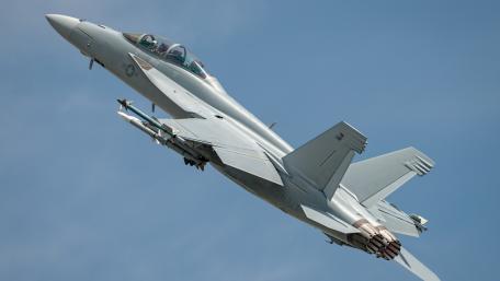Fighter Jet in Action Above the Clouds wallpaper