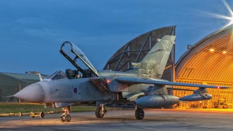 Dynamic Nighttime Military Jet Displaying Power and Precision wallpaper