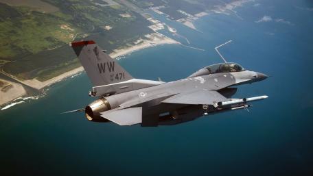 Fighter Jet Soaring Over the Coastline wallpaper