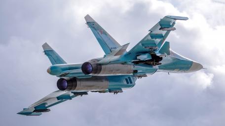 Sleek Fighter Jet in Mid-Flight Showcase wallpaper
