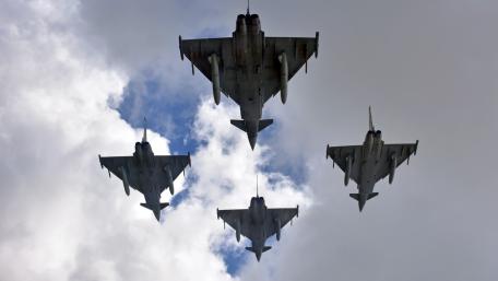 Warplanes in Formation Against Cloudy Sky wallpaper