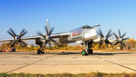 Classic Military Aircraft on the Tarmac wallpaper