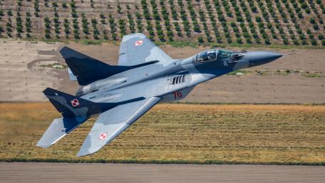 Dynamic Flight of a Military Jet in Action wallpaper