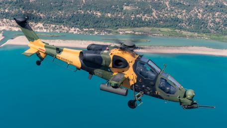 Military Helicopter in Action Over Stunning Coastline wallpaper