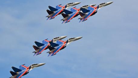 Synchronized Flight of Modern Jets in Action wallpaper