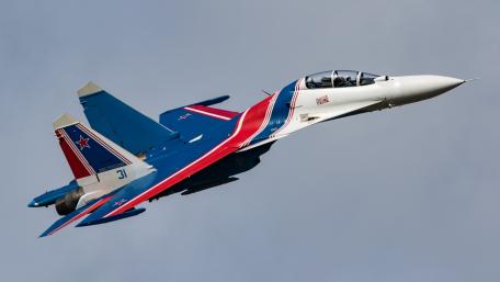 Sleek Fighter Jet Soaring Through the Sky wallpaper