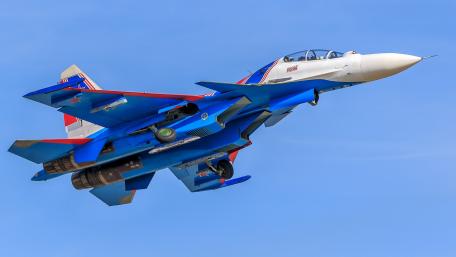 Fighter Jet Soaring Through Clear Skies wallpaper