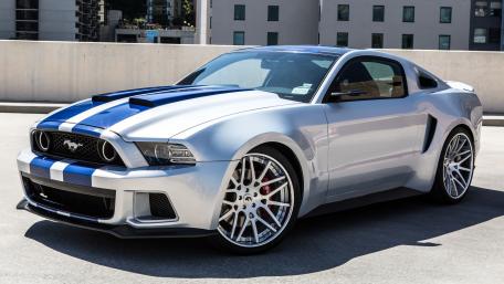 Sleek Silver Mustang in Urban Setting wallpaper