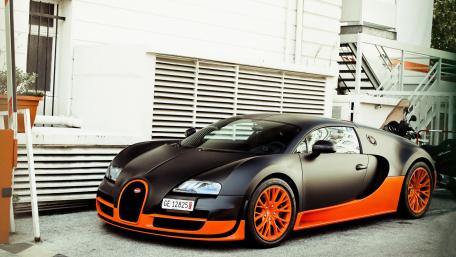 Sleek Black and Orange Supercar Design wallpaper