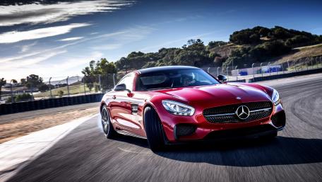 Sleek Red Sports Car in Motion wallpaper