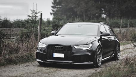 Sleek Audi RS6 on a Misty Road wallpaper
