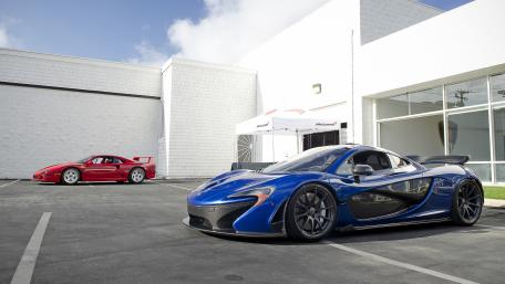 Exquisite Car Collection in Vibrant Setting wallpaper