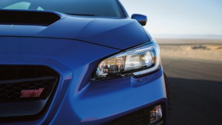 Sleek Blue Sports Car Wallpaper wallpaper