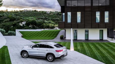 Sleek Luxury SUV in a Modern Landscape wallpaper