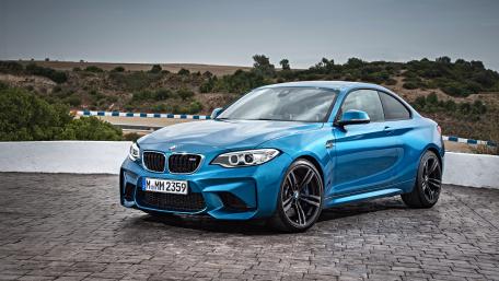 Sleek Blue BMW M2 on Dynamic Terrain wallpaper