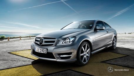 Sleek Silver Mercedes-Benz on Open Road wallpaper