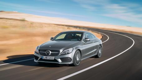Sleek Mercedes Coupe on Open Road wallpaper