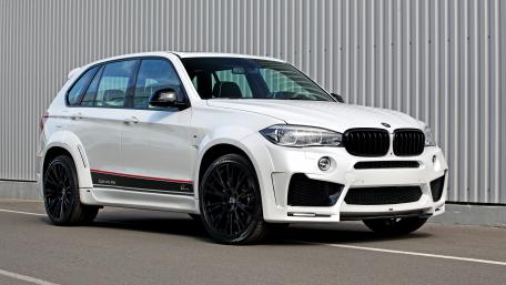 Sleek White BMW SUV in Urban Setting wallpaper