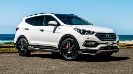 Sleek White SUV by the Shoreline wallpaper