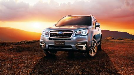 Sleek Subaru Forester Against a Vibrant Sunset Scene wallpaper