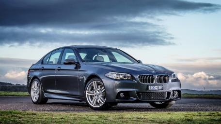 Sleek BMW on a Scenic Road wallpaper