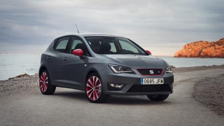 Sleek Gray Hatchback by the Shoreline wallpaper