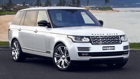 Sleek Luxury Range Rover by the Coastline wallpaper