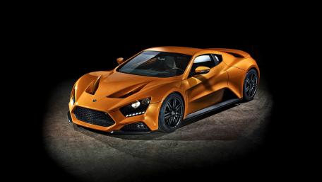 Sleek and Powerful Orange Supercar Wallpaper wallpaper