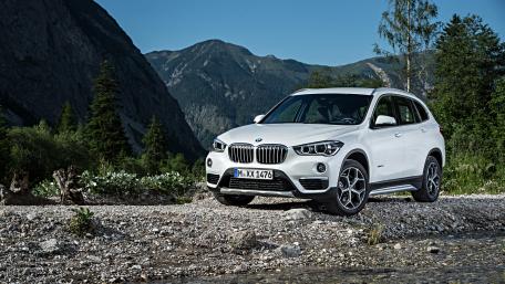 Sleek BMW X1 in Scenic Mountain Setting wallpaper
