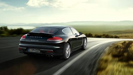 Sleek Porsche Cayman on a Scenic Drive wallpaper