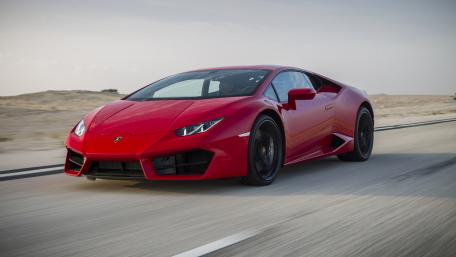 Sleek Red Lamborghini on Open Road wallpaper
