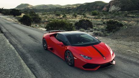 Sleek Red Supercar on an Open Road wallpaper