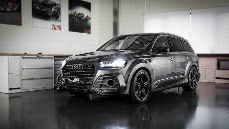 Sleek Audi SUV in a Modern Workshop Setting wallpaper